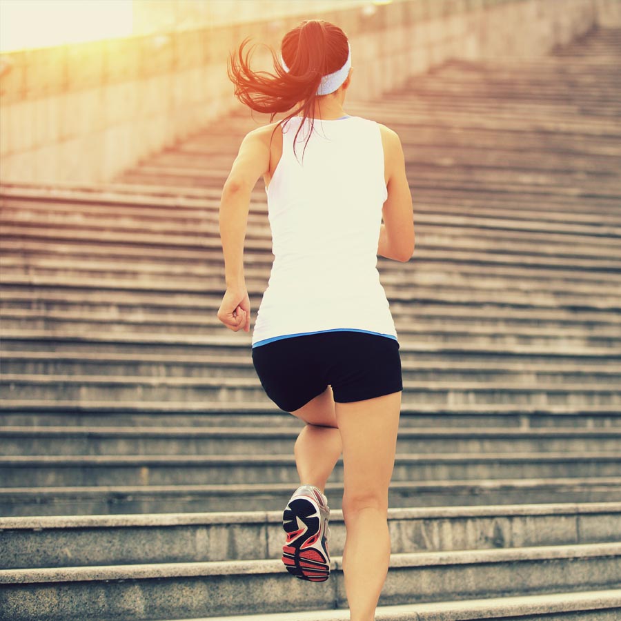 Image of a woman running up stairs for a women in business blog